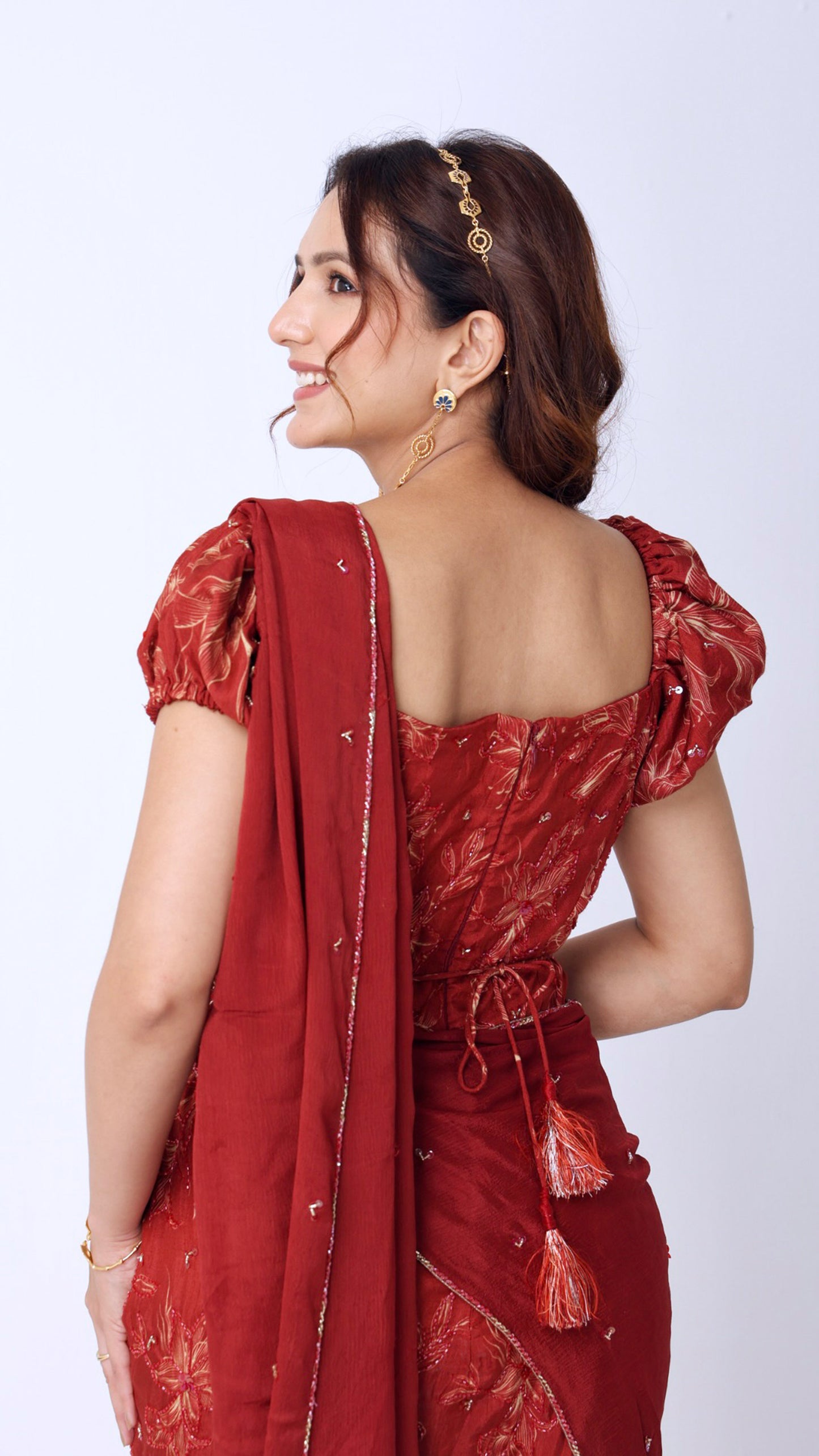 Maroon floral hand-embroidered fish-cut saree gown with puff sleeves and belt