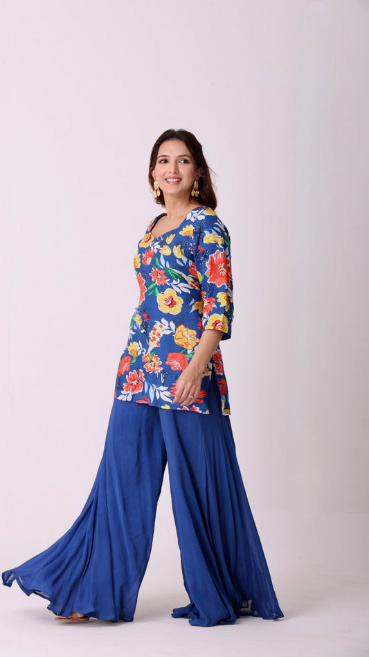 Floral hand-embroidered kurta paired with flowy flare blue sharara pants