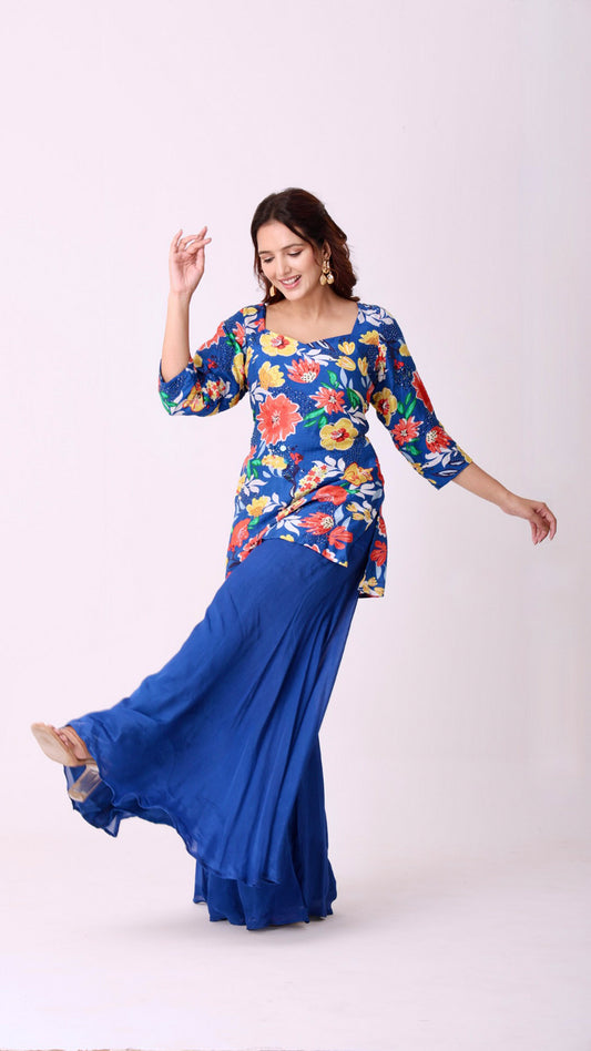 Floral hand-embroidered kurta paired with flowy flare blue sharara pants