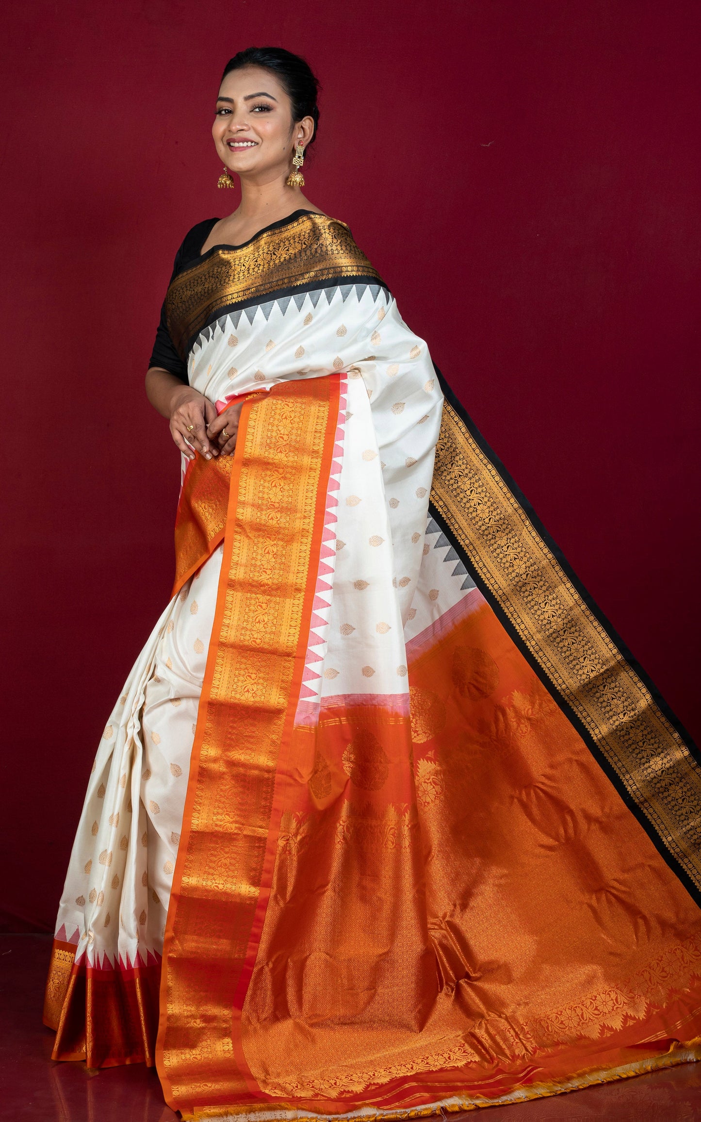Exclusive Gadwal Silk Saree in Off White, Black, Burnt Orange and Golden Zari Weave