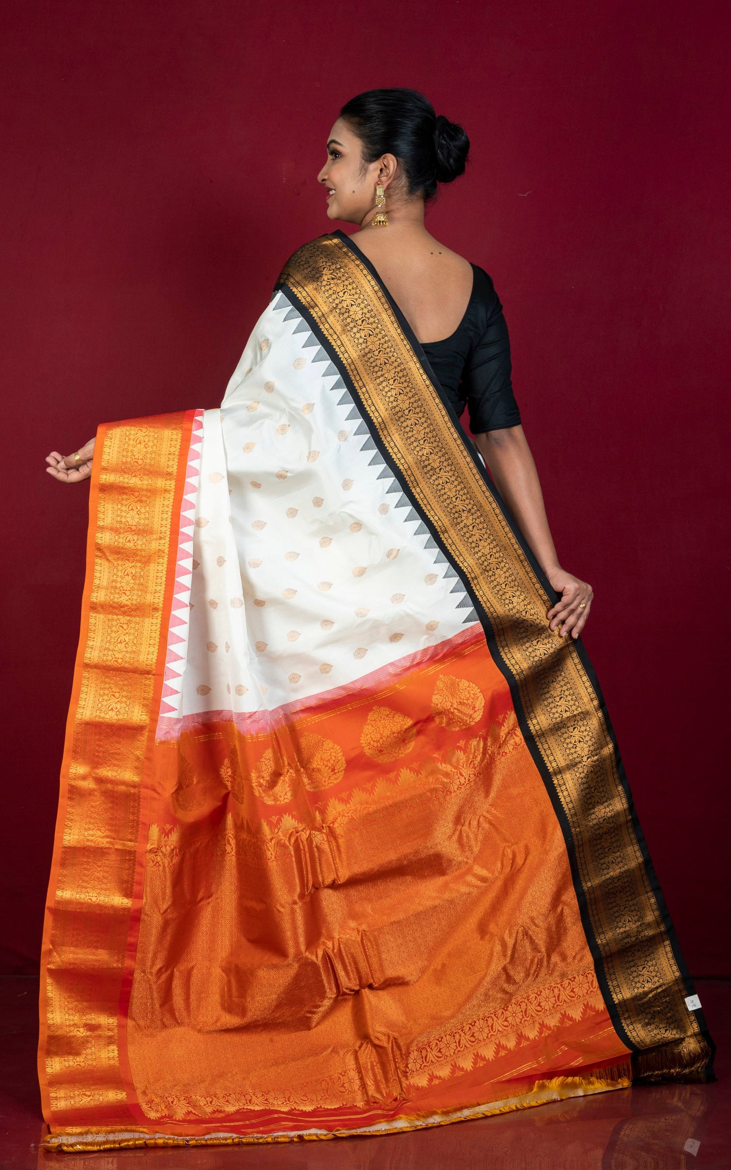Exclusive Gadwal Silk Saree in Off White, Black, Burnt Orange and Golden Zari Weave
