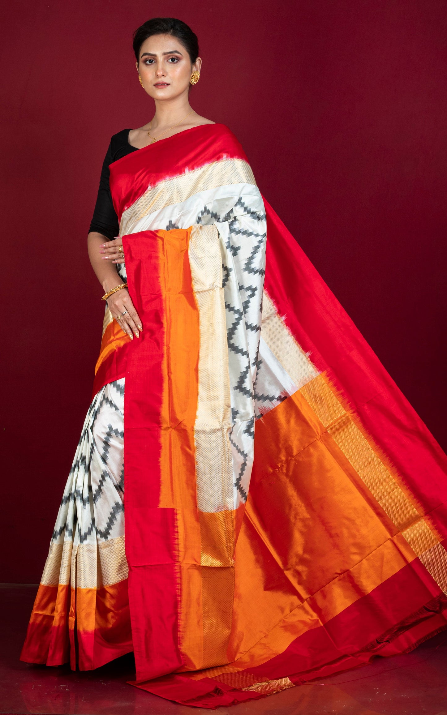 Designer Skirt Border Ikkat Pochampally Silk Saree in Off White, Red, Fire Orange, Black and Antique Golden