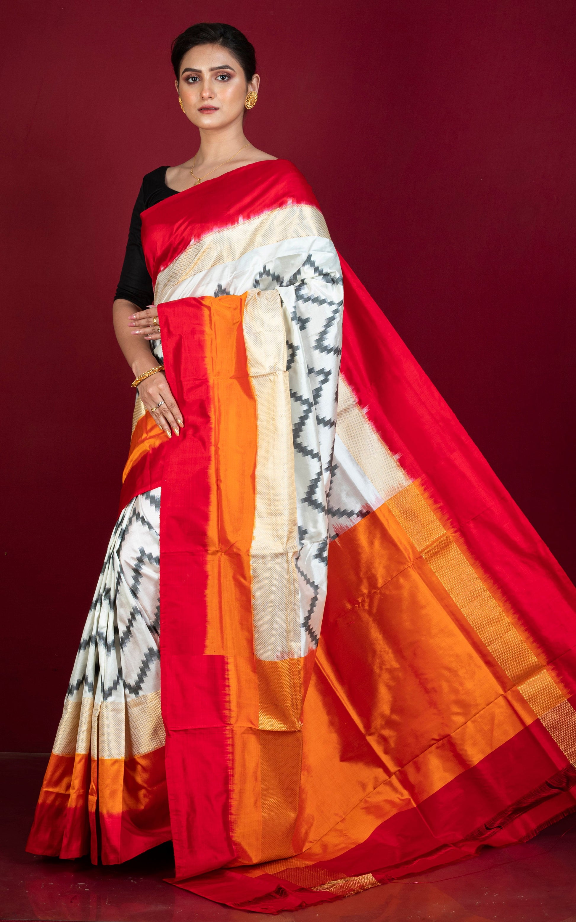 Designer Skirt Border Ikkat Pochampally Silk Saree in Off White, Red, Fire Orange, Black and Antique Golden