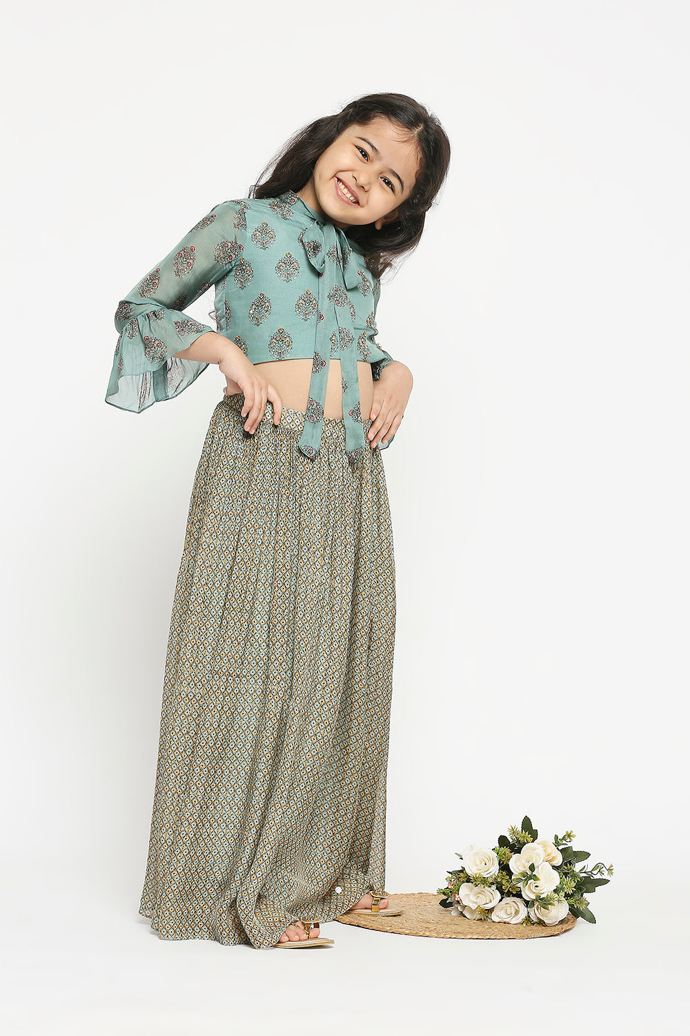 Muasir Printed Skirt Paired With Crop Top Which Has Bell Sleeves And Neck Tie Up