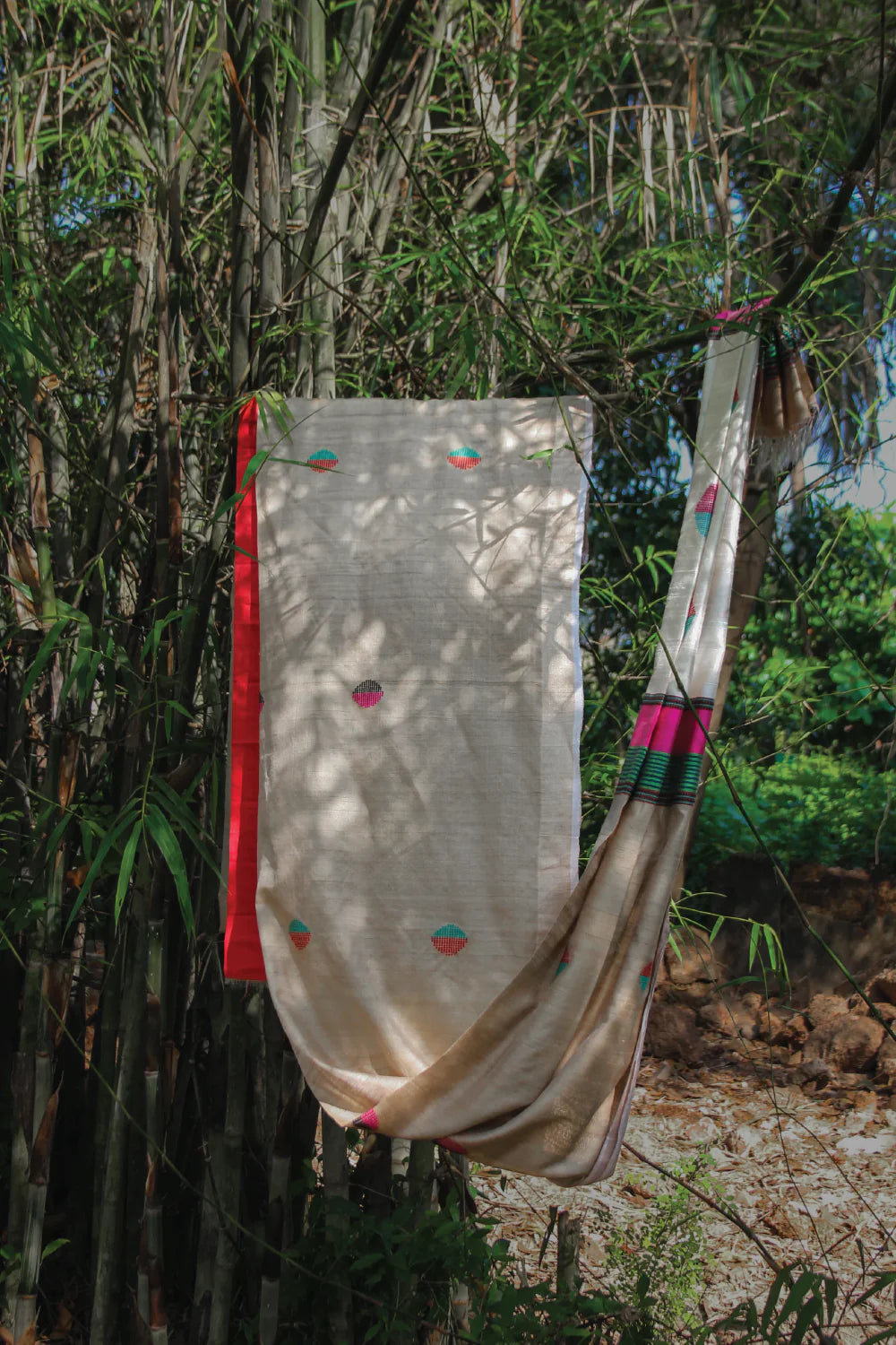 Beige handloom pure Kosa silk saree with Cream colour pallu & Red & Green gemetrical motifs
