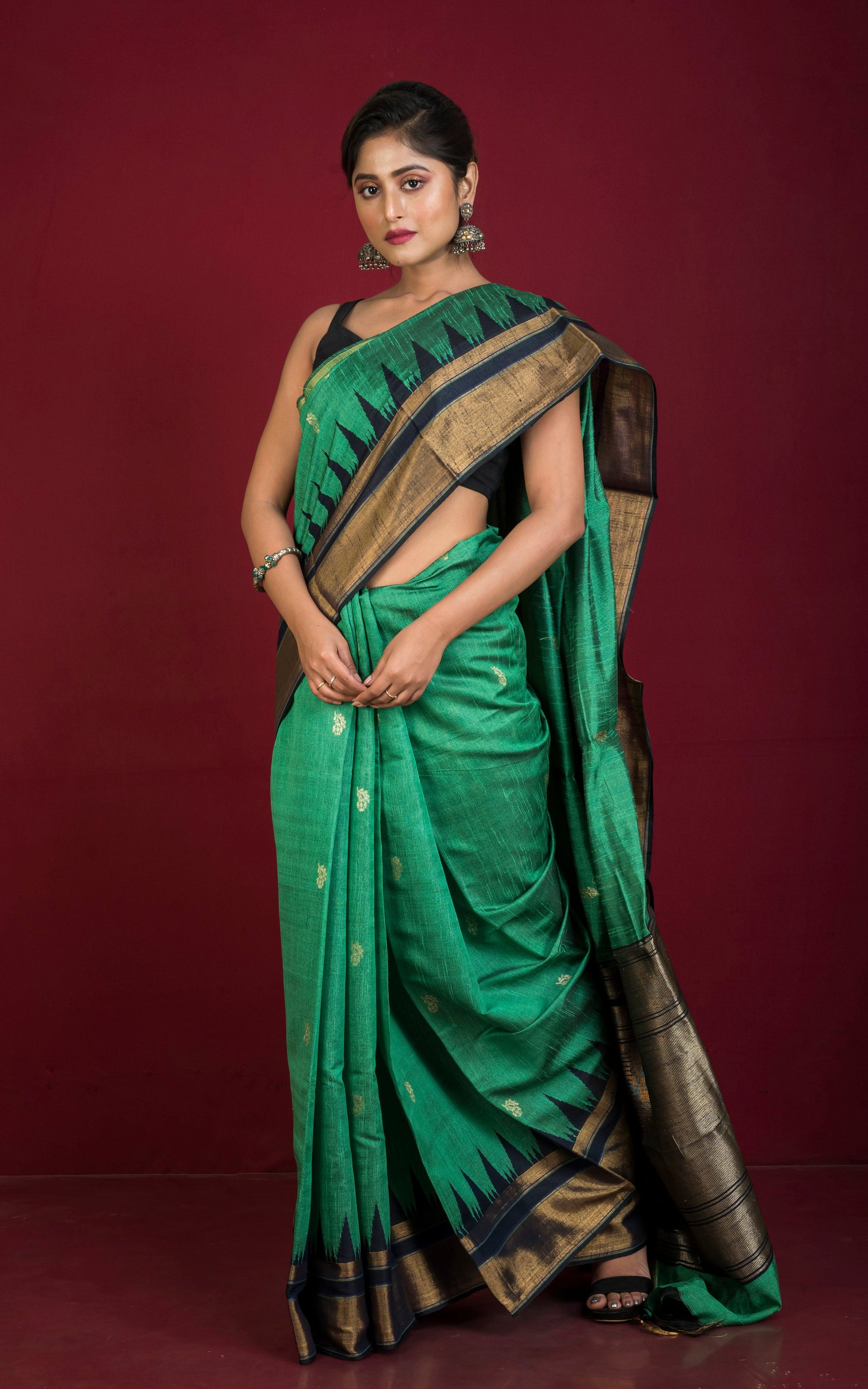 Handwoven Crowned Temple Border Tussar Raw Silk Saree in Emerald Green and Black with Rich Pallu