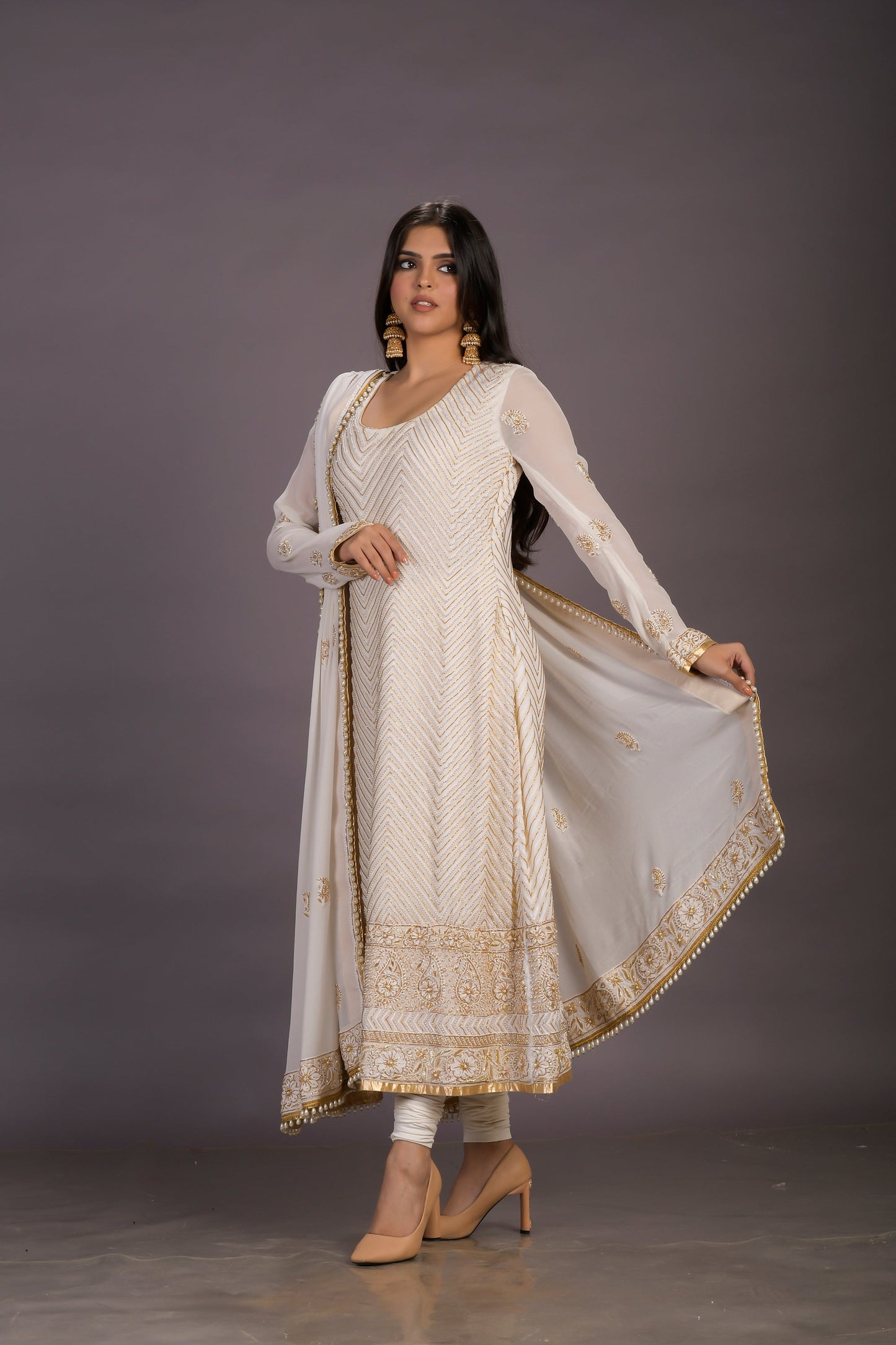 A Classic Cream Chikankari Suit With Gold And Pearl Embellishments