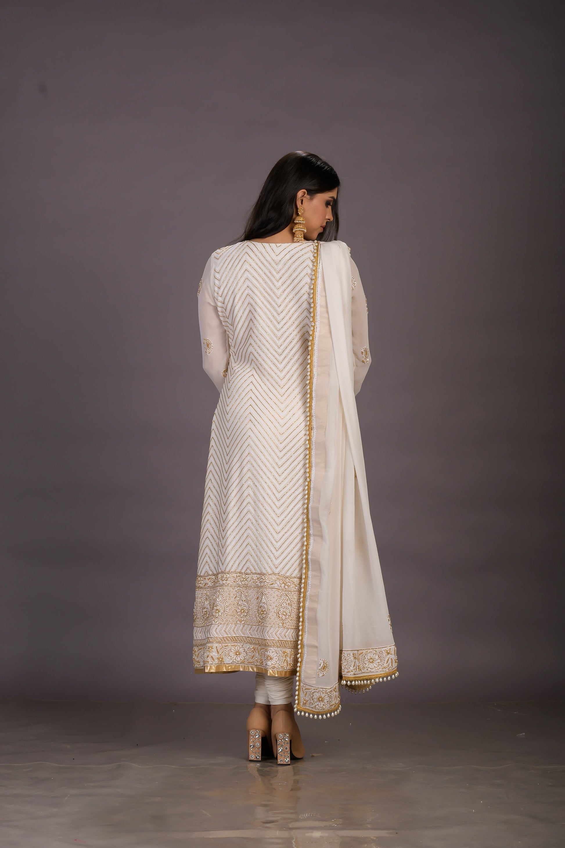 A Classic Cream Chikankari Suit With Gold And Pearl Embellishments